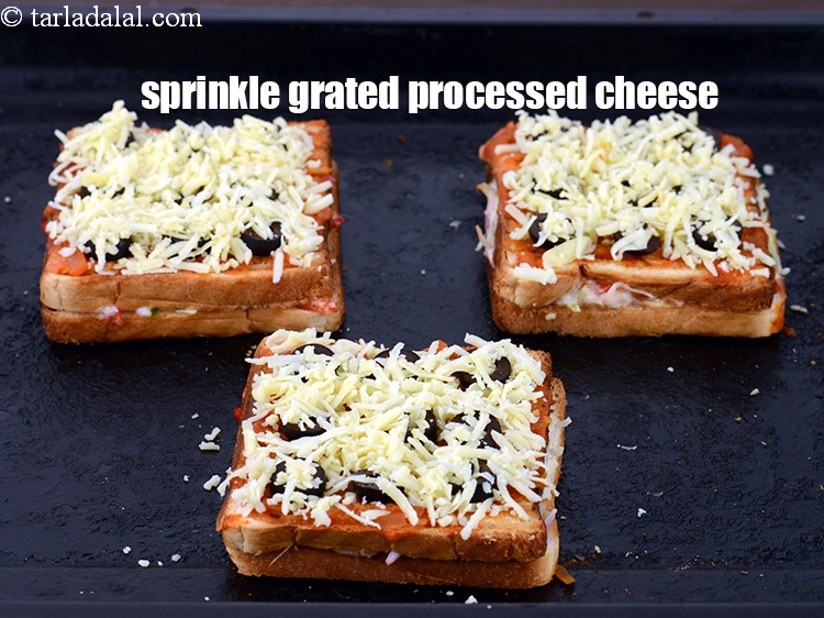 Step 21 – Sprinkle 2 tbsp of <a href="https://www.tarladalal.com/glossary-grated-processed-cheese-868i">grated processed cheese</a>