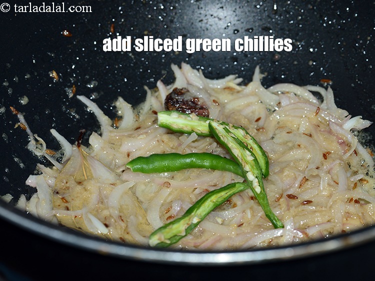 Step 21 – Add 2 <a href="https://www.tarladalal.com/glossary-sliced-green-chillies-936i">sliced green chillies</a>.&nbsp;