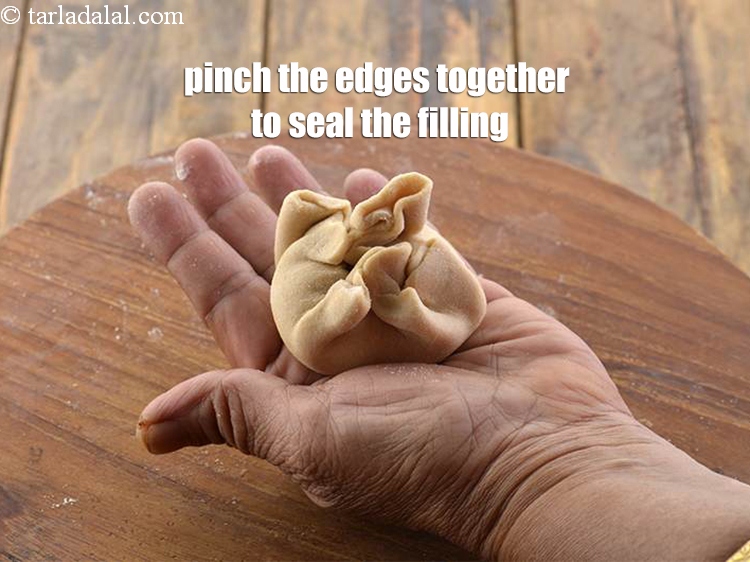 Step 28 – Bring together all the sides in the centre and seal.