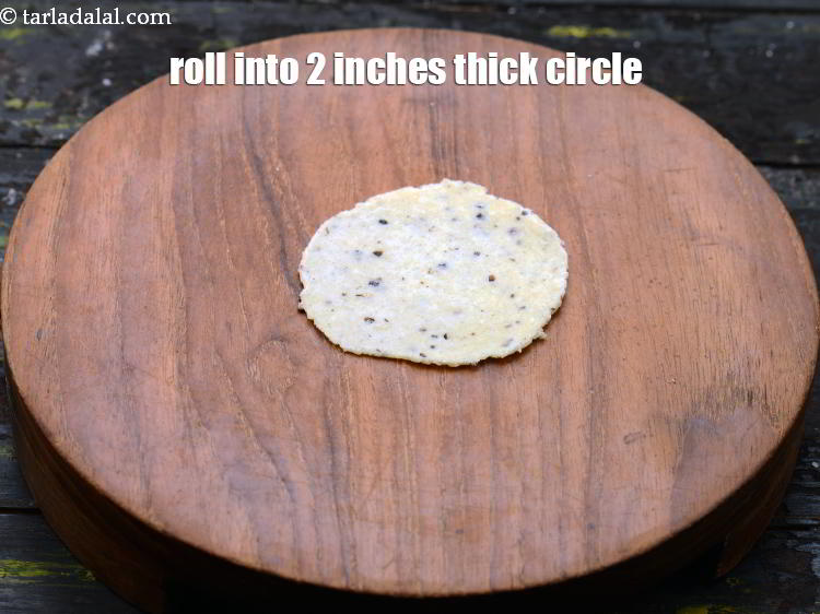 Step 23 – Roll into a 50 mm. (2&rdquo;) diameter thick circle without using any flour.