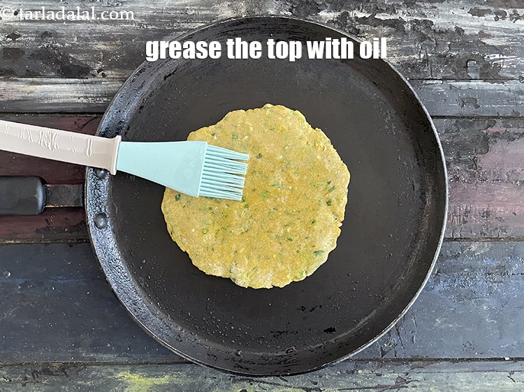 Step 24 – Grease the top of the paratha with oil.