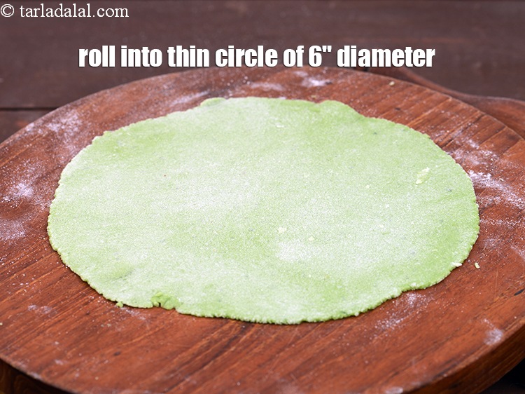 Step 21 – Gently roll out into a thin circle of 150 mm. (6") diameter, using rice flour …