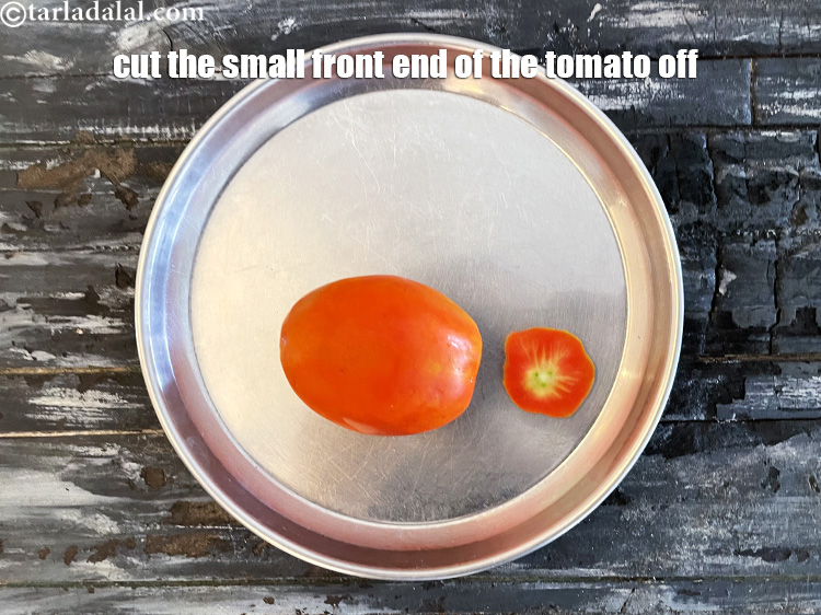 Step 27 – To deseed the tomato, we will first cut the small front end of the tomato.