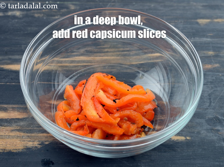 Step 22 – In a deep bowl, add the red capsicum slices.