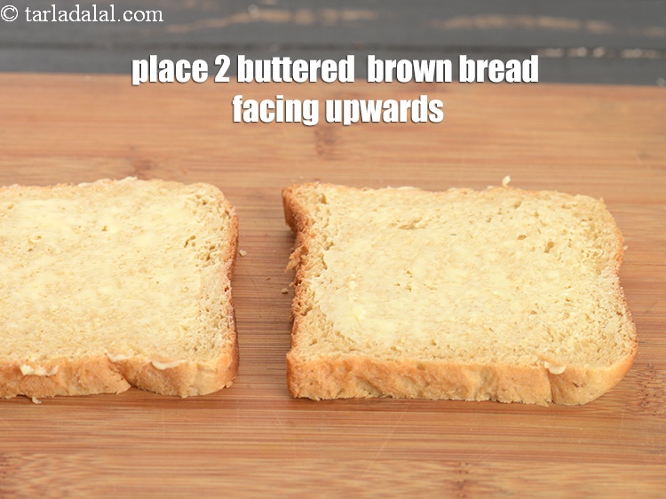 Step 22 – Place 2 buttered &nbsp;<a href="https://www.tarladalal.com/glossary-brown-bread-223i">brown bread</a>&nbsp;on a clean, dry surface with the buttered side facing …