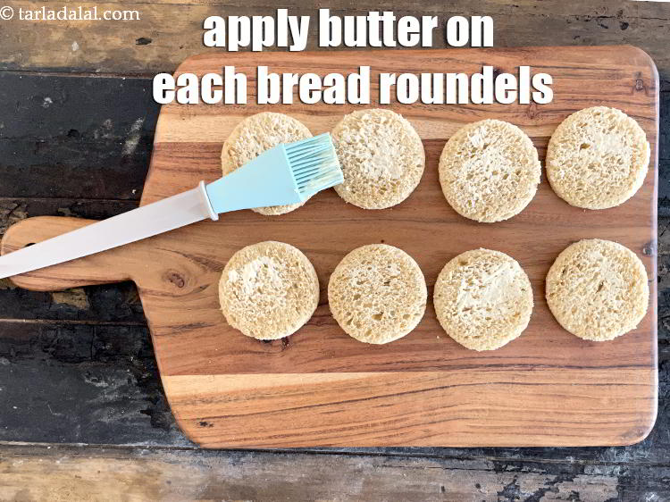 Step 20 – <meta charset="UTF-8" />Apply &frac14; tsp of butter on each bread roundel.