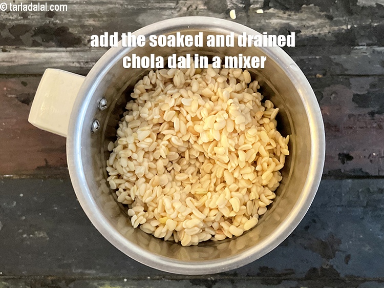 Step 8 – <meta charset="UTF-8" /> For the batter of&nbsp;<strong>dal pandoli</strong>, add the soaked and drained chola dal …
