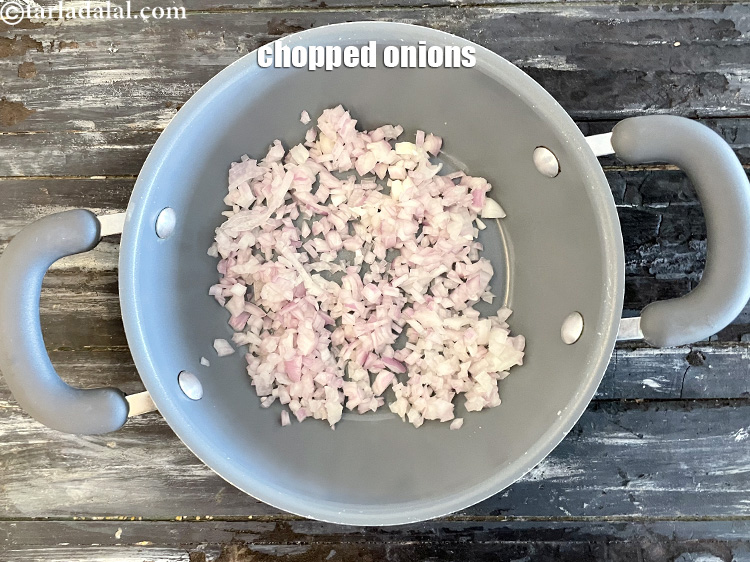 Step 12 – <meta charset="UTF-8" />In a broad non-stick pan put&nbsp;1/2 cup&nbsp;roughly&nbsp;<a href="glossary-chopped-onions-722i">chopped onions</a>.
