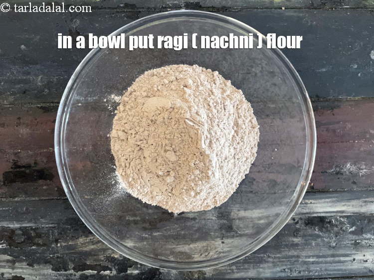 Step 4 – <meta charset="UTF-8" />In a bowl put&nbsp;1 cup&nbsp;<a href="glossary-ragi-flour-nachni-flour-nachni-ka-atta-red-millet-flour-1115i">ragi (nachni / red millet) flour</a>.&nbsp;<br /> &nbsp;
