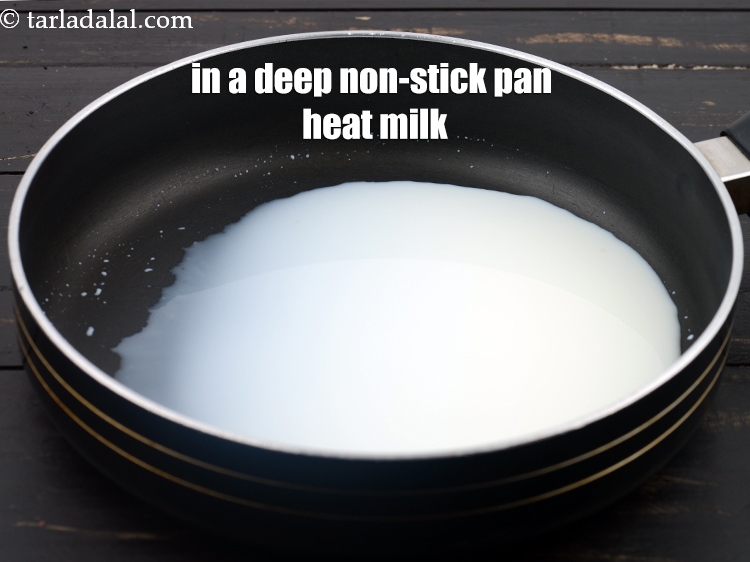 Step 3 – To make eggless brookies, in a deep nonstick pan heat &frac14; cup milk.