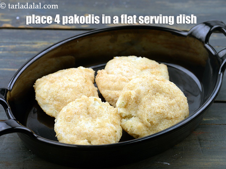 Step 63 – Place 4 pakodis in a flat serving dish.