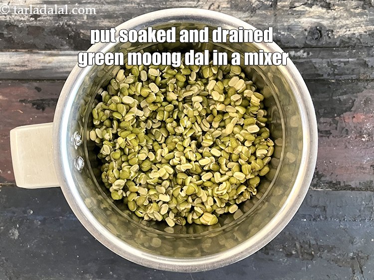 Step 14 – In a mixer, add the soaked and drained split green moong dal.