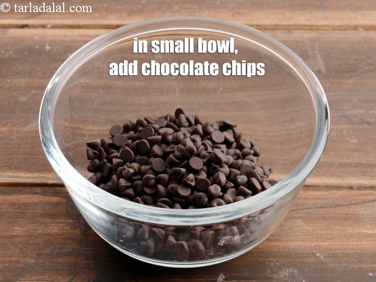 Step 3 – To make <strong>Eggless chocolate chip muffins</strong>, in a small bowl, add &frac12; cup <a href="https://www.tarladalal.com/glossary-chocolate-chips-325i">chocolate …