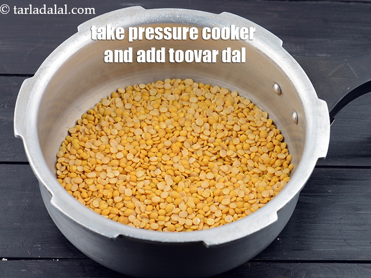 Step 3 – Take a pressure cooker and add the 1 cup&nbsp;<a href="https://www.tarladalal.com/glossary-toovar-dal-arhar-dal-toor-dal-split-pigeon-peas-tur-dal-955i">toovar (arhar) dal</a>.&nbsp;