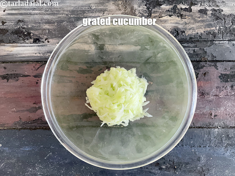 Step 7 – In a glass bowl put&nbsp;<meta charset="UTF-8" />1/2 cup&nbsp;<a href="glossary-grated-cucumber-1058i">grated cucumber</a>.