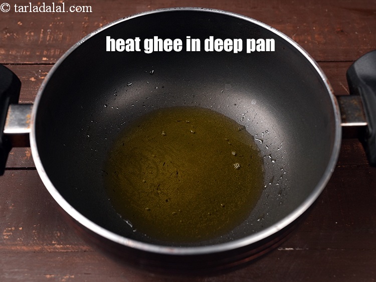 Step 4 – To make<strong> Upvas aloo bhaji</strong>, heat 1 tbsp <a href="https://www.tarladalal.com/glossary-ghee-245i">ghee</a> in a deep nonstick pan.