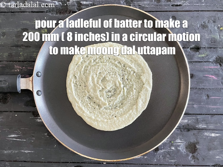 Step 35 – <meta charset="UTF-8" /> To make <strong>moong dal uttapam&nbsp;</strong>pour a ladleful of the batter on it …