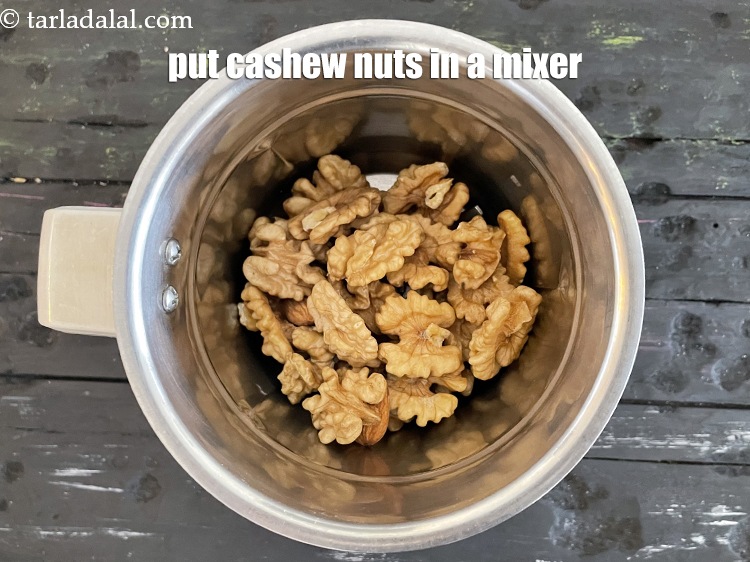 Step 3 – Put 1 cup walnuts in a mixer.