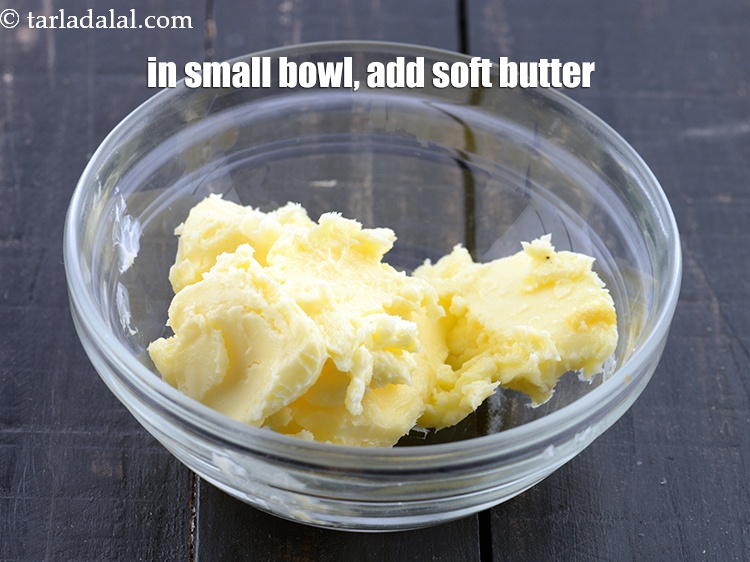 Step 3 – To make <strong>Ladi pav&nbsp;garlic bread</strong>, in a small bowl, add 3 tbsp&nbsp;<a href="https://www.tarladalal.com/glossary-soft-butter-naram-makhan-1942i">soft butter</a>.