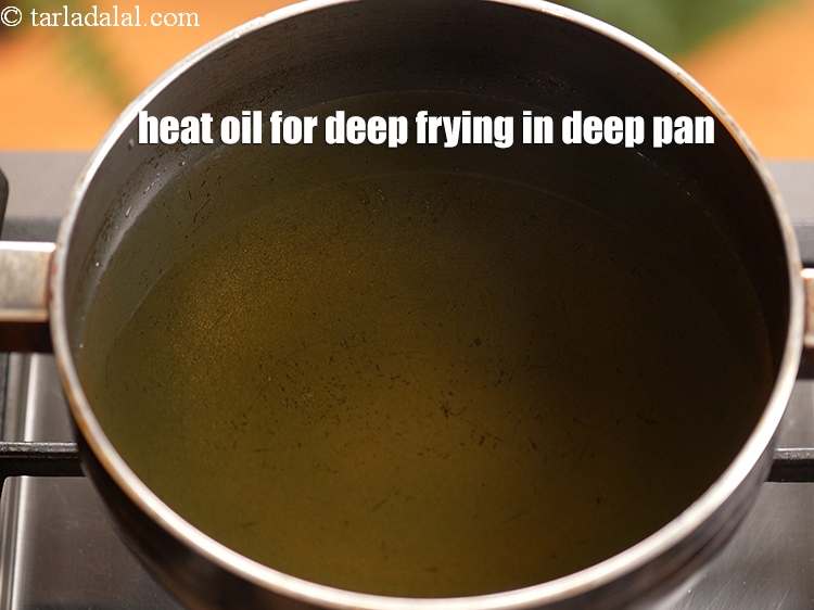 Step 3 – To make <strong>Kung pao potatoes</strong>, heat the oil for deep frying in a deep pan.