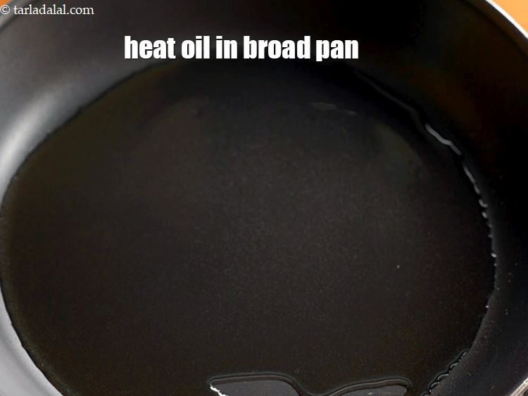 Step 3 – Heat 1 1/2 tbsp of oil in a broad non-stick pan.