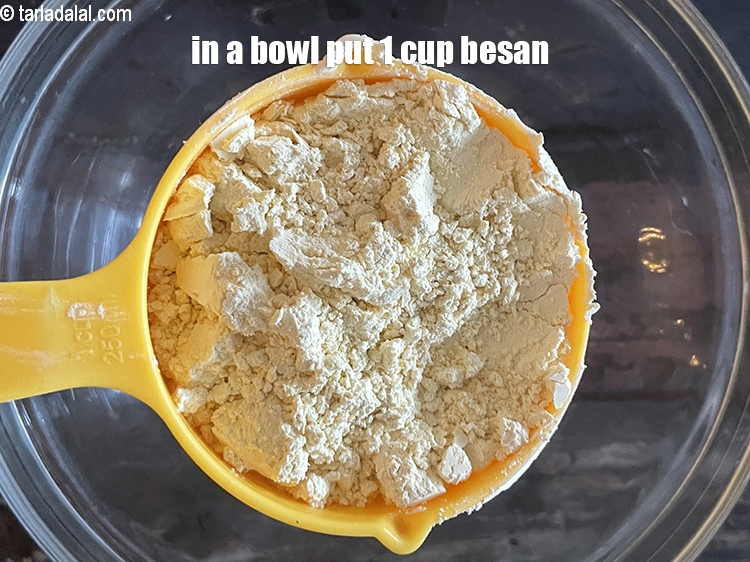 Step 3 – In a deep bowl put&nbsp;<meta charset="UTF-8" />1 cup&nbsp;<a href="glossary-besan-chana-dal-flour-bengal-gram-flour-952i">besan (bengal gram flour)</a>.