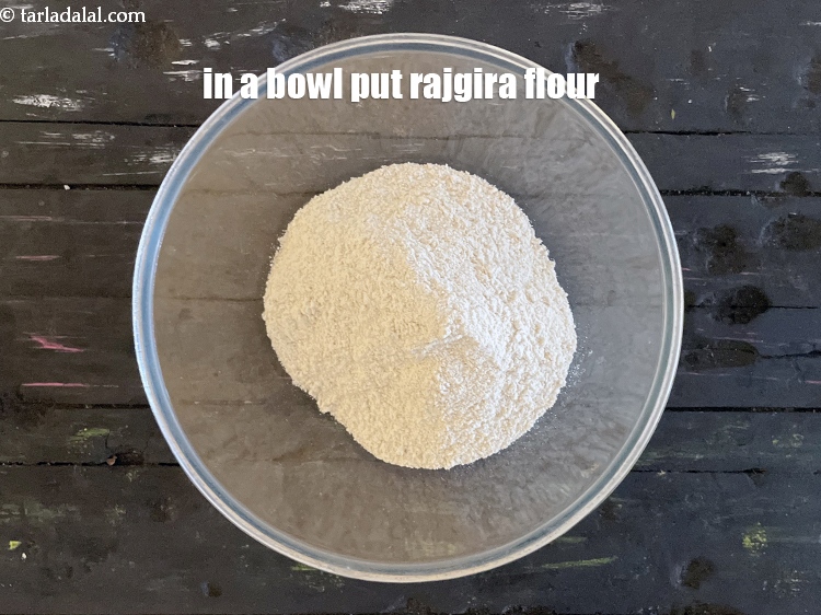Step 3 – In a deep bowl put&nbsp;<meta charset="UTF-8" />1 cup&nbsp;<a href="glossary-rajgira-flour-ramadana-flour-amaranth-flour-rajgira-ka-atta-1297i">rajgira flour</a>&nbsp;(cholai/ramdaana).