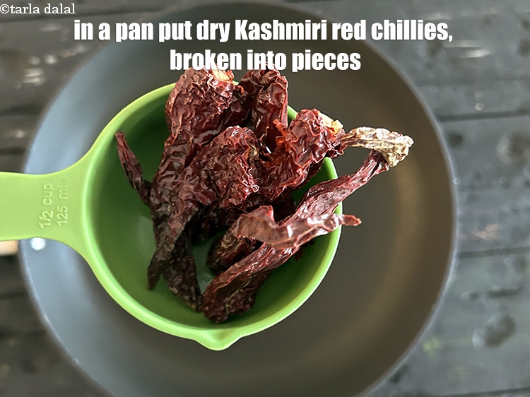 Step 4 – In a pan put&nbsp;<meta charset="UTF-8" />6&nbsp;<a href="glossary-whole-dry-kashmiri-red-chillies-kashmiri-mirch-kashmiri-lal-mirch-332i">whole dry kashmiri red chillies</a>&nbsp;, broken into pieces.