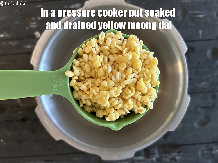 Step 23 – In a pressure cooker, put the&nbsp;soaked and drained&nbsp;moong dal.&nbsp;<meta charset="UTF-8" />3 tbsp&nbsp;<a href="glossary-yellow-moong-dal-split-yellow-gram-peeli-moong-dal-488i">yellow moong dal …