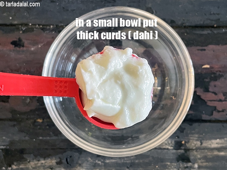 Step 14 – In a bowl put&nbsp;<meta charset="UTF-8" />2 tbsp&nbsp;<a href="glossary-thick-curds-2097i">thick curds (dahi)</a>.