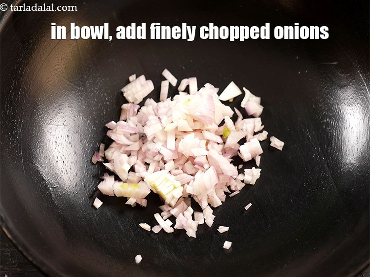 Step 3 – In a deep bowl, add 1/4 cup finely <a href="https://www.tarladalal.com/glossary-chopped-onions-722i">chopped onions</a>.
