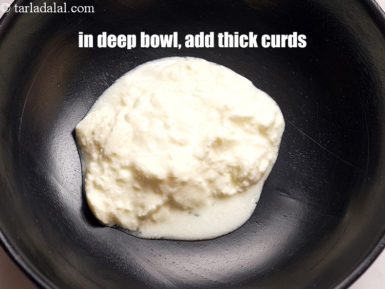 Step 3 – To make <strong>paneer tikka</strong>, in a deep bowl, add &frac12; cup <a href="https://www.tarladalal.com/glossary-thick-curds-2097i">thick curds (dahi)</a>.