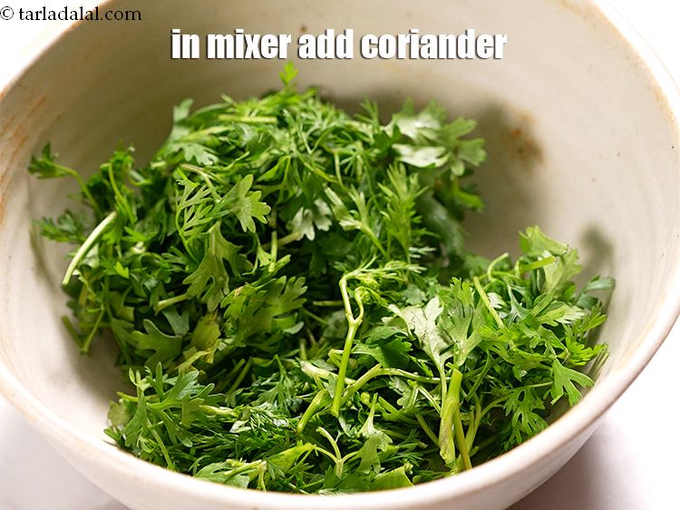 Step 3 – To make <strong>hariyali dum aloo recipe</strong>, in a mixer add &frac12; cup <a href="https://www.tarladalal.com/glossary-coriander-dhania-kothmir-369i">coriander (dhania)</a>.