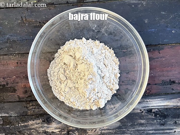 Step 3 – In a deep bowl put&nbsp;<meta charset="UTF-8" />1 cup&nbsp;<a href="glossary-bajra-flour-bajra-ka-atta-bajre-ka-atta-176i">bajra (black millet) flour</a>.