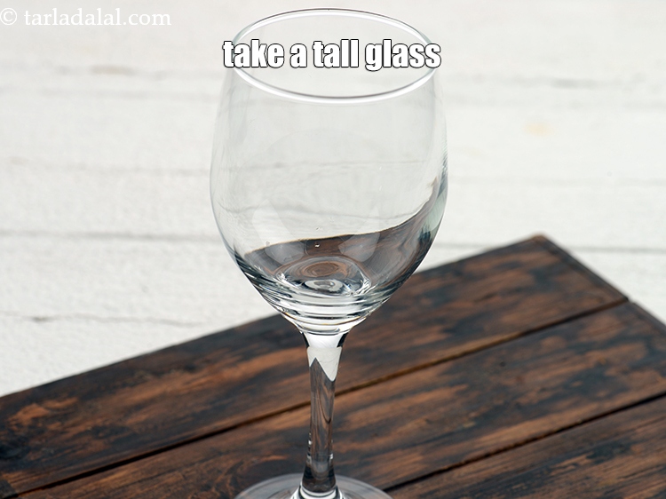 Step 3 – To make <strong>blue lagoon mocktail recipe</strong>, take a tall glass.