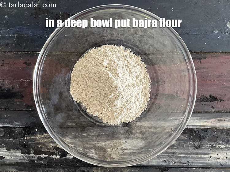 Step 4 – In a deep bowl put&nbsp;1/2 cup&nbsp;<a href="https://tarladalal.com/glossary-bajra-flour-bajra-ka-atta-bajre-ka-atta-176i">bajra (black millet) flour</a>.