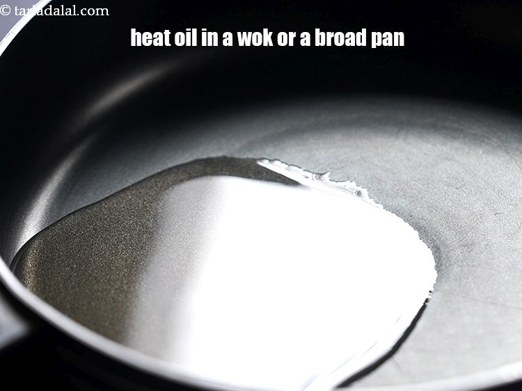 Step 11 – Heat 2 tbsp&nbsp;<a href="https://www.tarladalal.com/glossary-oil-671i">oil</a>&nbsp;in a wok or a broad non-stick pan.
