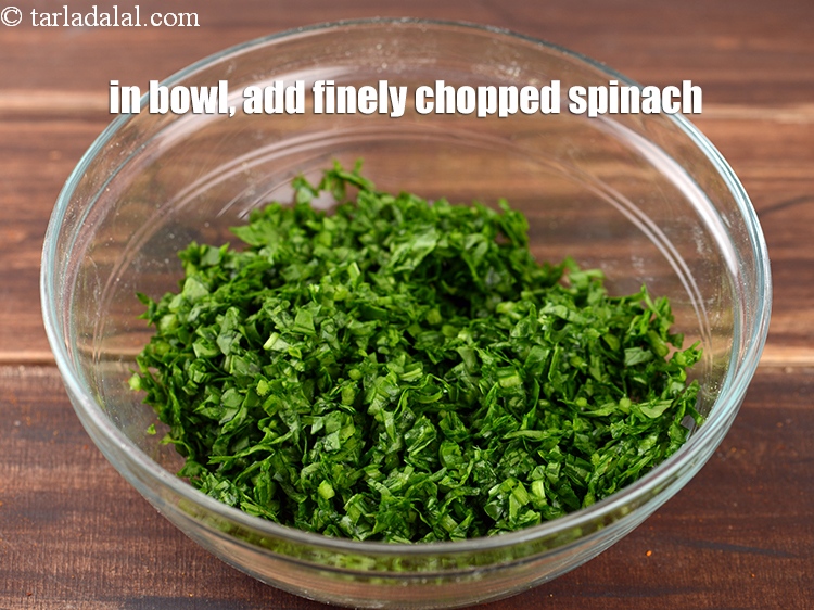 Step 3 – To make<strong> Palak pakoda</strong>, in a deep bowl, 1 1/2 cups finely <a href="https://www.tarladalal.com/glossary-chopped-spinach-780i">chopped spinach …