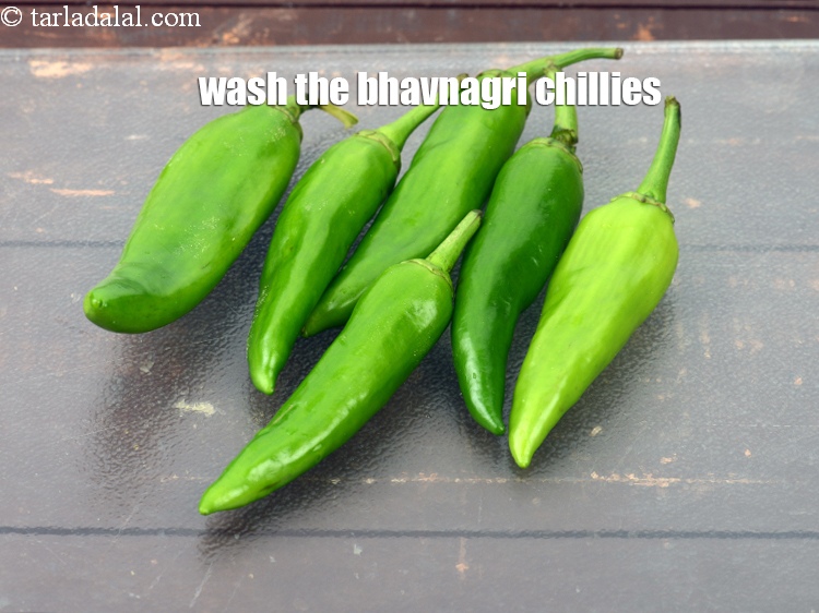 Step 4 – These are <a href="https://www.tarladalal.com/glossary-bhavnagri-chillies-bhavnagri-mirchi-337i">bhavnagri chillies</a>. Wash them with clean water.
