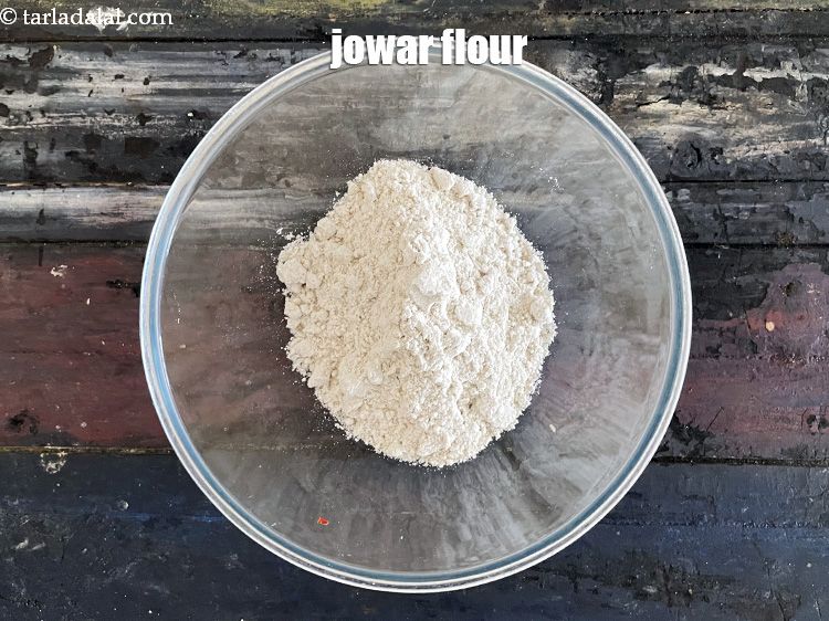 Step 5 – In a deep glass bowl, put 3/4&nbsp;cup&nbsp;<a href="glossary-jowar-flour-jowar-ka-atta-white-millet-flour-sorghum-flour-483i">jowar (white millet) flour</a>.