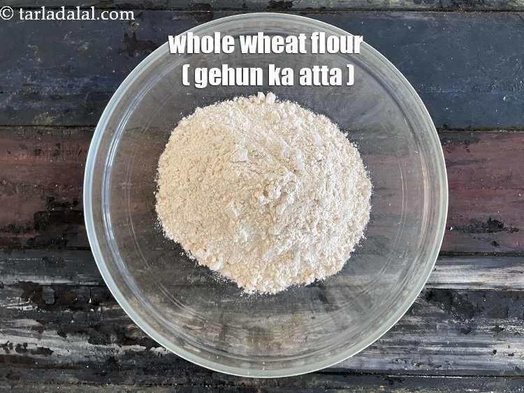 Step 5 – In a deep bowl put&nbsp;<meta charset="UTF-8" />1 1/2 cups&nbsp;<a href="glossary-whole-wheat-flour-gehun-ka-atta-gehun-ka-aata-429i">whole wheat flour (gehun ka atta)</a>.