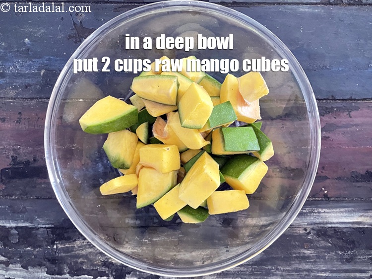 Step 11 – To make&nbsp;spicy mango pickle, in a deep bowl put&nbsp;2 cups&nbsp;<a href="https://tarladalal.com/glossary-raw-mango-cubes-2034i">raw mango cubes</a>.