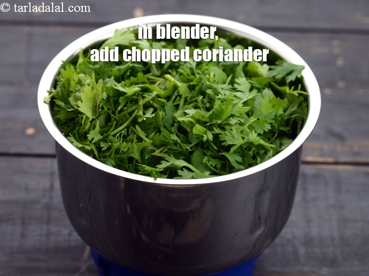 Step 8 – In a blender, add 1 &frac12; cups <a href="https://www.tarladalal.com/glossary-chopped-coriander-783i">chopped coriander (dhania)</a>.