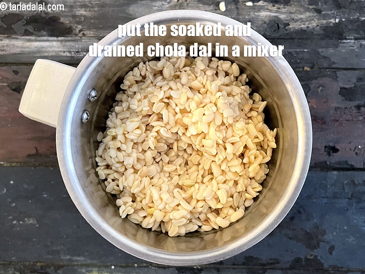 Step 9 – Put the soaked and drained chola dal in a mixer jar.