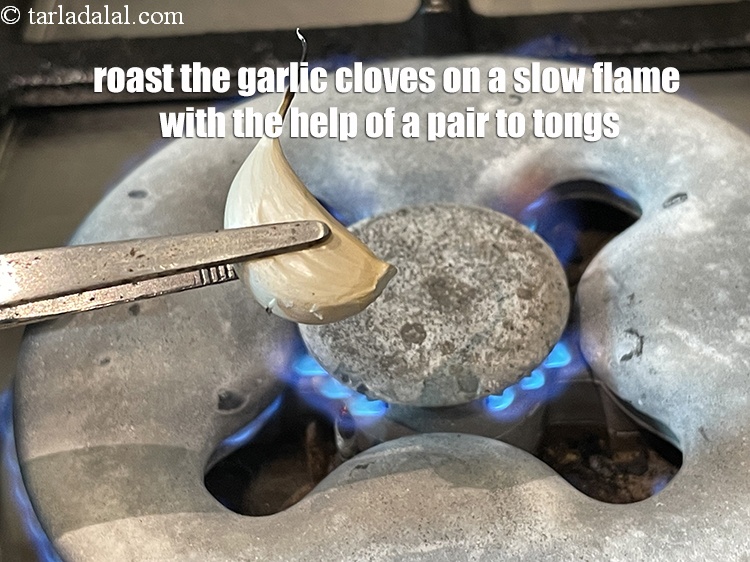 Step 11 – Roast the garlic cloves on a slow open flame,&nbsp;with the help of a pair of …
