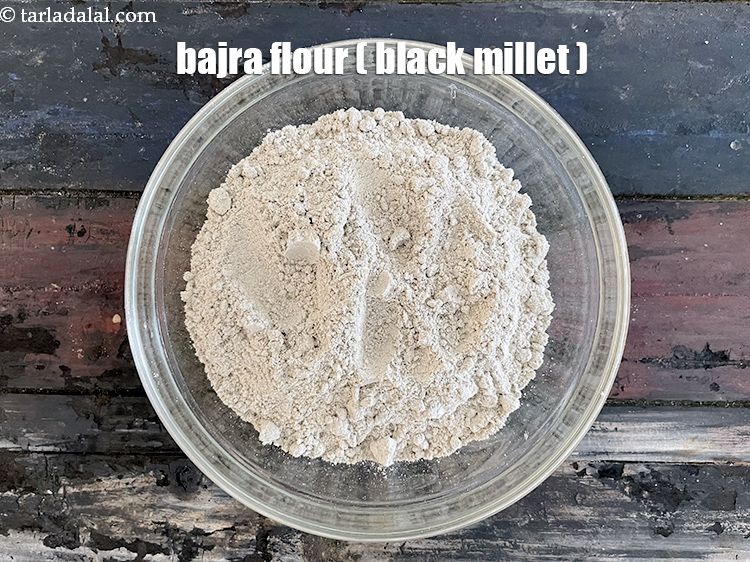 Step 12 – In a bowl put&nbsp;2 cups&nbsp;<a href="glossary-bajra-flour-bajra-ka-atta-bajre-ka-atta-176i">bajra (black millet) flour</a>.
