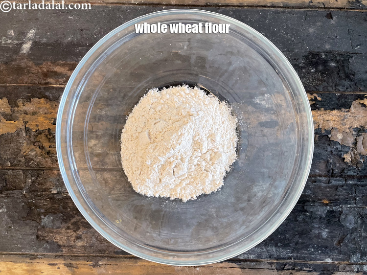 Step 3 – <html><head><meta charset="UTF-8"></head><body><p>In a bowl out 3/4 cup&nbsp;<a href="glossary-whole-wheat-flour-gehun-ka-atta-gehun-ka-aata-429i">whole wheat flour (gehun ka atta)</a>.</p></body></html>