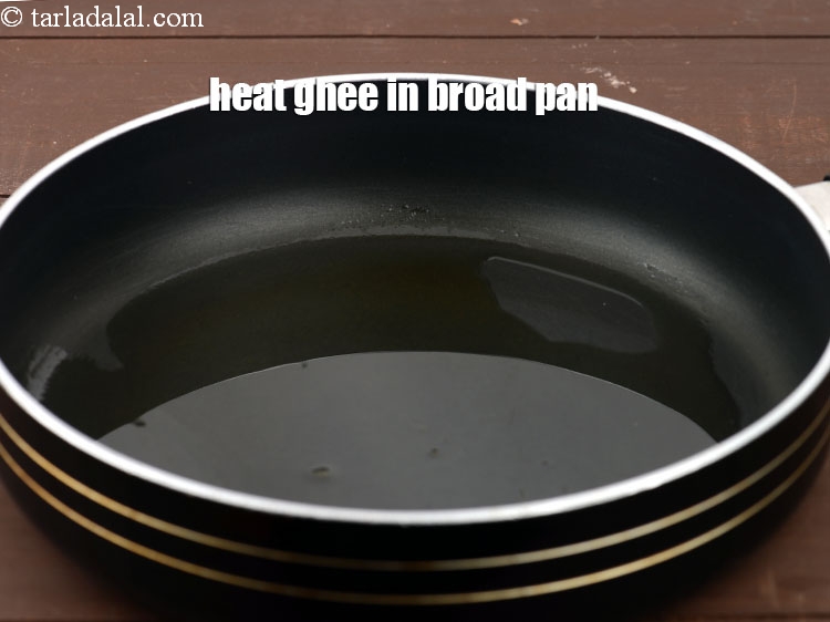 Step 3 – Heat 1 tbsp&nbsp;<a href="https://www.tarladalal.com/glossary-ghee-245i">ghee</a> in a broad non-stick pan or a deep pan.