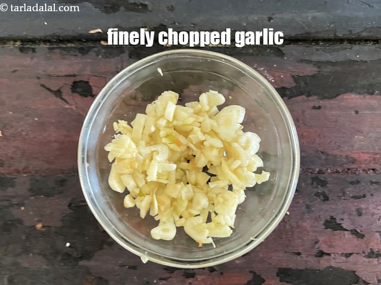 Step 6 – In a small bowl put&nbsp;1 tbsp&nbsp;finely&nbsp;<a href="glossary-chopped-garlic-790i">chopped garlic (lehsun)</a>.&nbsp;