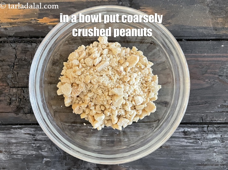 Step 5 – In a bowl put&nbsp;<meta charset="UTF-8" />5 tbsp&nbsp;coarsely&nbsp;<a href="https://www.tarladalal.com/glossary-raw-peanuts-kachi-mungfali-kachi-moongfali-847i#ing_917" target="_blank">crushed peanuts</a>.